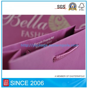 Purpurowa papierowa torba z wiązaną rączką